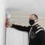 В квартирах Николай Николаев проверяет работу вентиляционной системы.